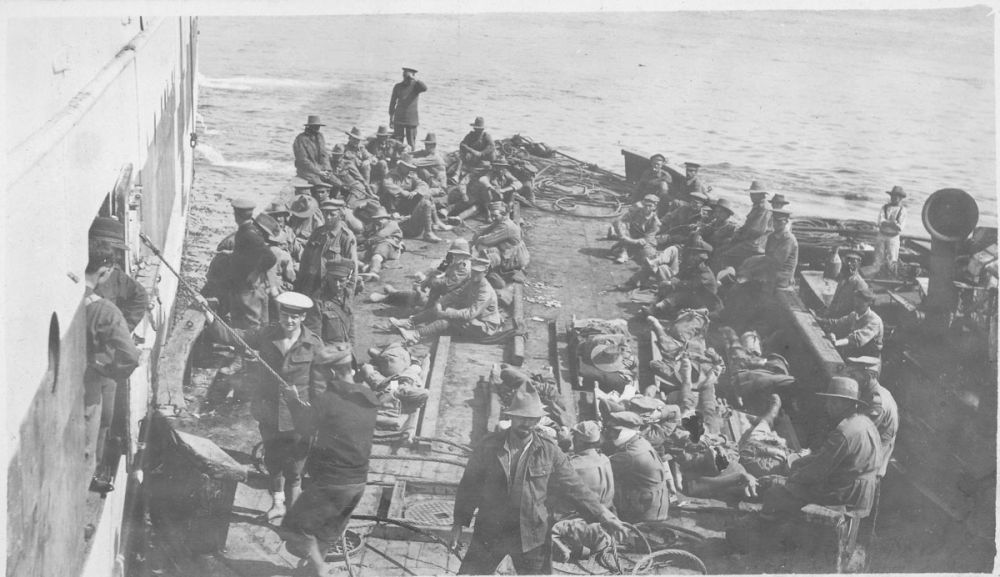 The sick and wounded on a barge ready to be transferred to a hospital ship.